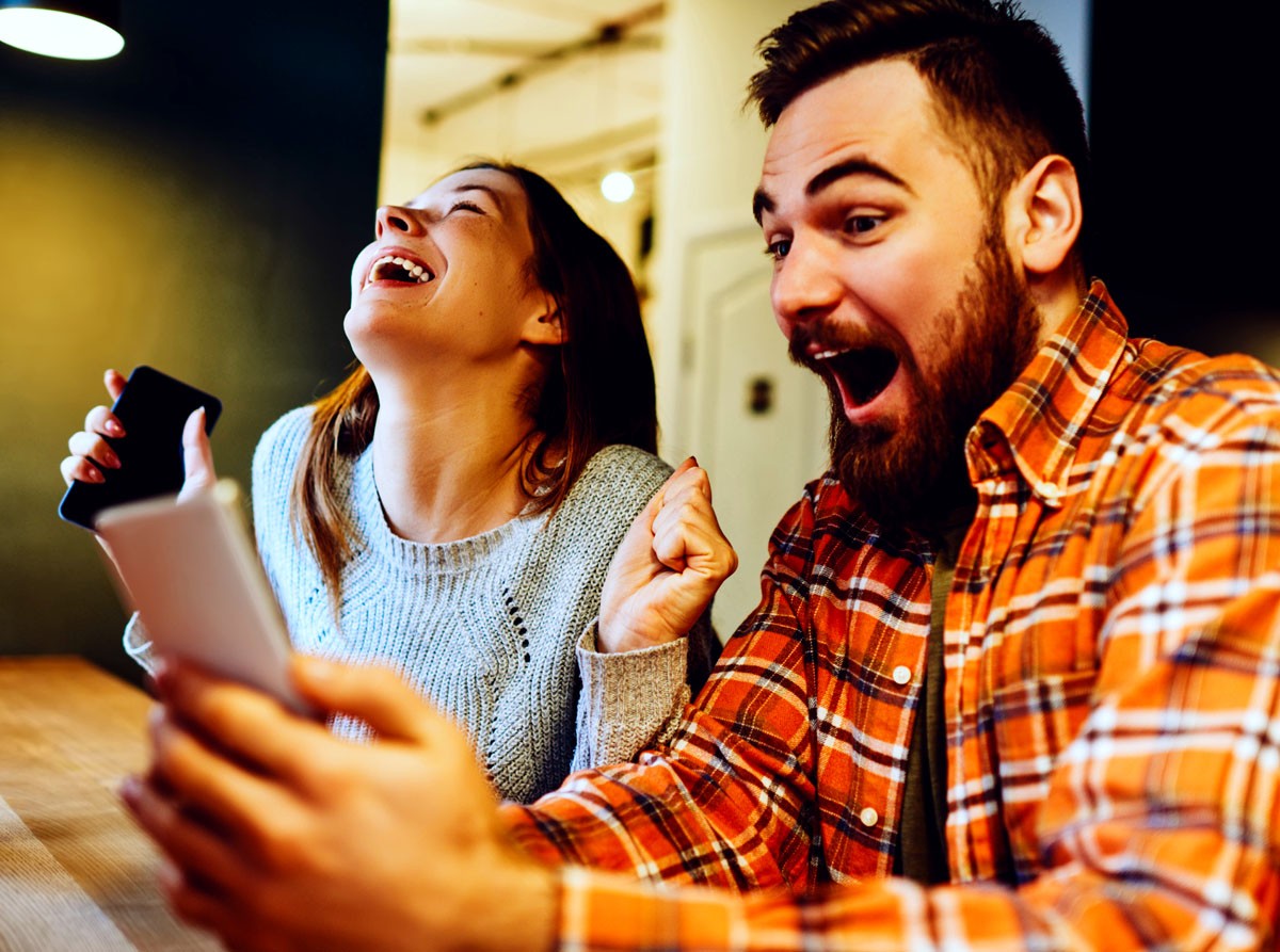 Couple winning a bid on a product, online auction